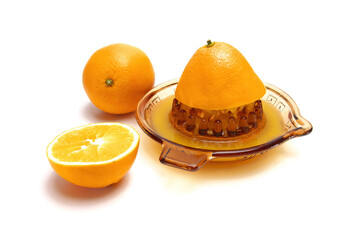 simple glass juicer for citrus fruits, oranges isolated on white