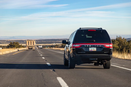 Arizona, United States - November 21, 2022: A picture of a black Lincoln Navigator EcoBoost driving in Arizona.