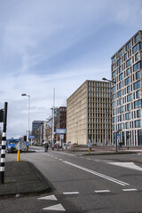 View of high-density residential and business area on the banks of the IJ River at the Oostelijke Handelskade (Eastern Docklands). Amsterdam, The Netherlands. 