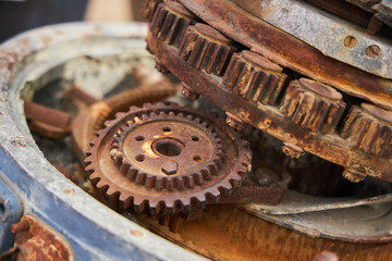 An old rusty mechanism. Gears and bearings of a vintage car.