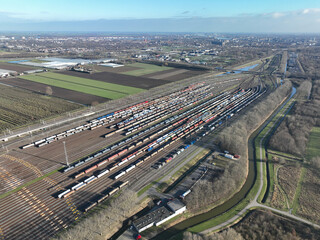 Get a unique perspective on the inner workings of the Kijfhoek train emplacement with this aerial drone video, highlighting the trains and transportation infrastructure.