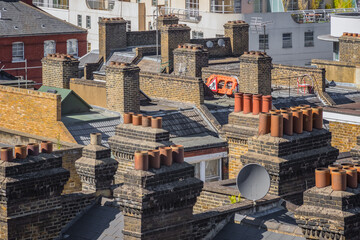 Rooftops and chimneys of English terraced houses in London, England