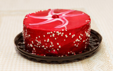 Fantastic Cherry cake is called Drunk Cherry, a delicious, sweet confection with red white glaze, white chocolate crumbs