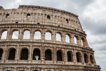 Fototapeta na wymiar Colosseum against cloudy sky