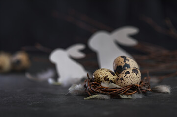 Easter card with quail eggs and paper rabbit. Template with a place for a congratulatory inscription. 