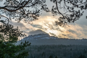 Ufa peak in the rays of the February sunset. View from the blueberry mountain. Aigir, Bashkortostan.