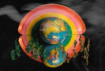 Composite image reflected in a mirror: terrestrial globe surrounded by plastic toy soldiers, against a flat cardboard background with the colors of peace and fog effect.