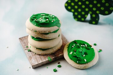 Saint Patricks day cookies with green frosting, selective focus