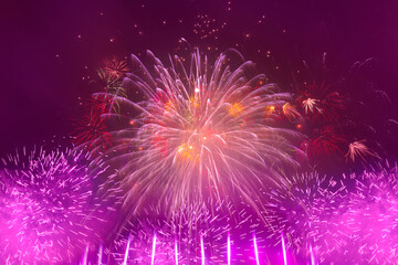 Beautiful colorful fireworks display lights up the sky with dazzling display during New Year...
