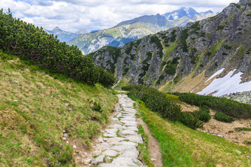 Fototapeta na wymiar Stone path in Tatra Mountains near the Valley of five ponds, Poland