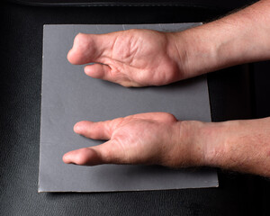 Special hands on a grey surface