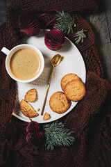 Cup of coffee with cookies on a tray.