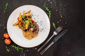 Juicy marble meat steak with sauce and herbs on wooden background