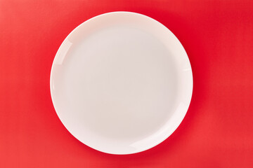 White plate on a red background. Graphic background for designers.