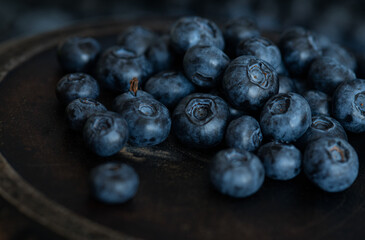 Blueberries in a bowl. Blueberries on a dark aged background.