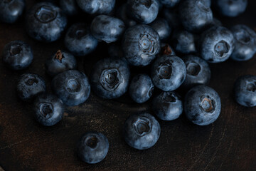 Blueberries in a bowl. Blueberries on a dark aged background.