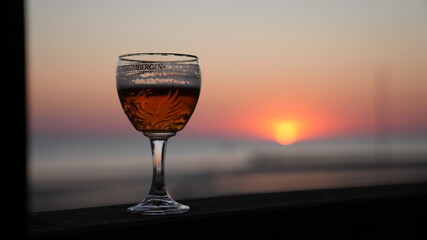 Beer setting in the sunset. Grimbergen.