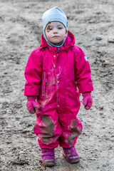 The little girl fell into the dirt