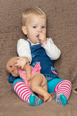 A little girl and a doll