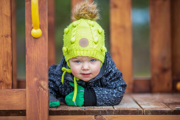 The little girl is on the playground