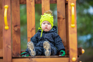 The little girl is on the playground