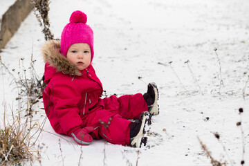 A little girl in the harsh northern winter