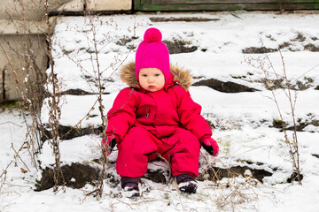 A little girl in the harsh northern winter