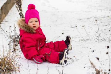 A little girl in the harsh northern winter