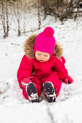 A little girl in the harsh northern winter