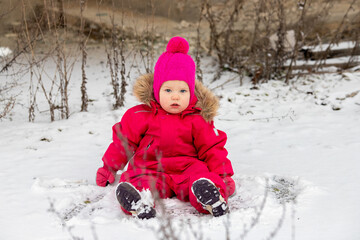 Fototapeta na wymiar A little girl in the harsh northern winter