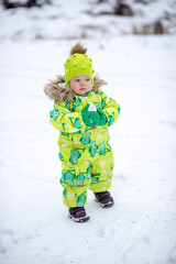 A little girl in the harsh northern winter