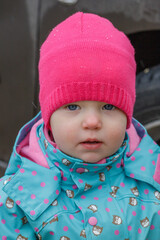 Portrait of a little girl in a red hat