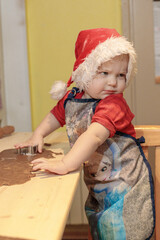 The elf makes gingerbread for Christmas