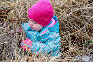Little girl and autumn hay