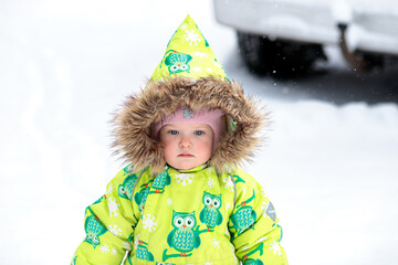 A little girl in the harsh northern winter