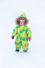 A little girl in the harsh northern winter