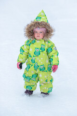 A little girl in the harsh northern winter