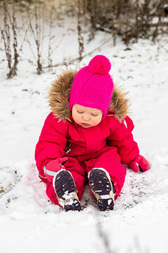 A little girl in the harsh northern winter