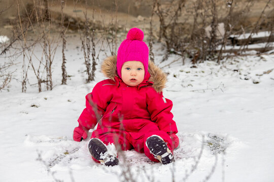 A little girl in the harsh northern winter