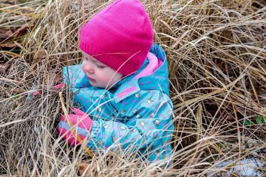 Little girl and autumn hay