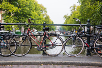 Fototapeta premium red bike on bridge leaning