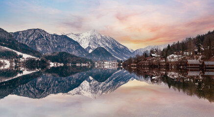 Cloudy winter Alpine  lake Grundlsee panorama (Austria) with fantastic pattern-reflection on the water surface.