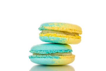 Two confectionery products, sweet macaroons, macro, isolated on white background.