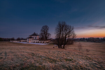 Winter sunset with color sky near Andelska Hora village with ruins and chapel