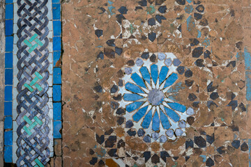 An aged mosaic tiled floor at Cherratine Madrasa in the old medina of Fez, Morocco