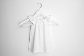 Mockup of white baby cotton dress on white background. Layout mock up ready for your design...