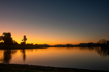 Fototapeta na wymiar Sunrise Over Lake in Fountain Hills Arizona