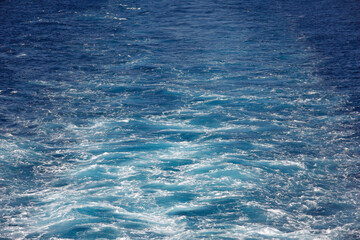 Swirled water trace behind a cruise ship