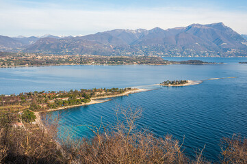 Obraz premium Aerial view of the Lake Garda with the Rabbit Island and the Garda Island from Manerba
