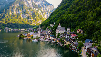 Fototapeta premium Aerial view of Hallstatt village, mountains background in Austria Stock Photos and Images